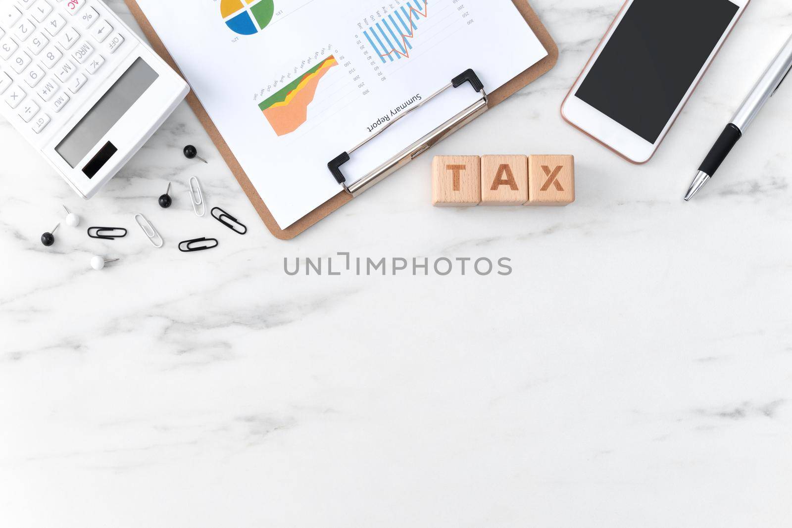 Top view of reading the overview and calculating, paying tax with smart phone from internet.