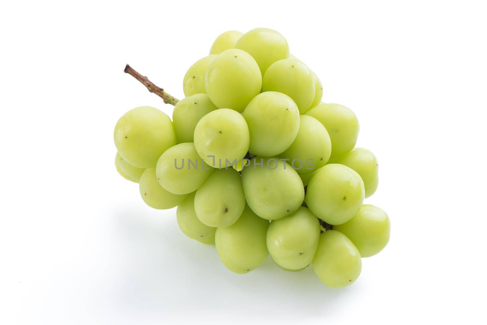 Close up of beautiful a bunch of Shine Muscat green grape isolated on white background, clipping path cut out.