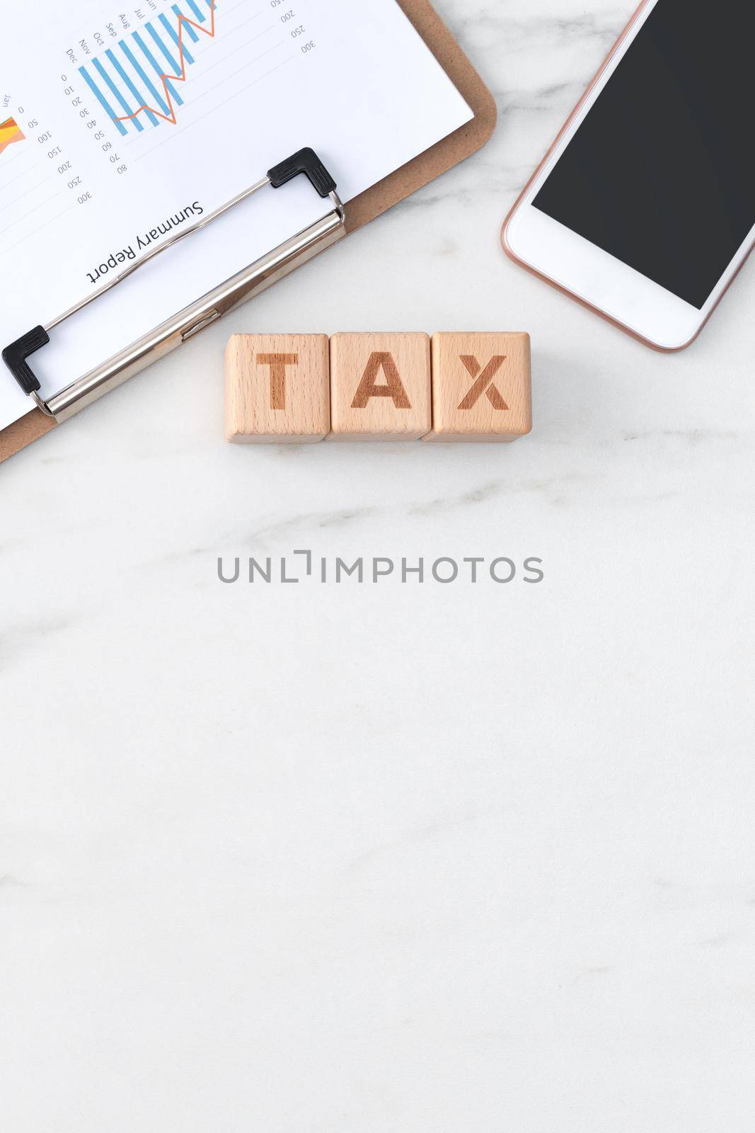 Top view of reading the overview and calculating, paying tax with smart phone from internet.