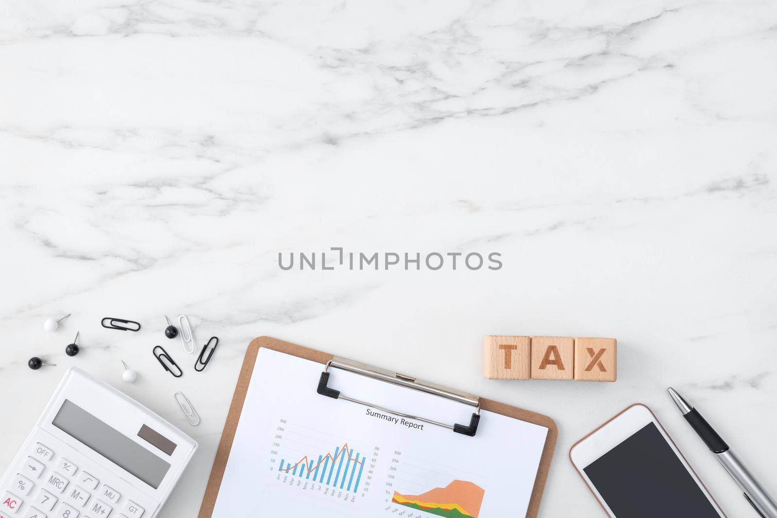 Top view of reading the overview and calculating, paying tax with smart phone from internet.