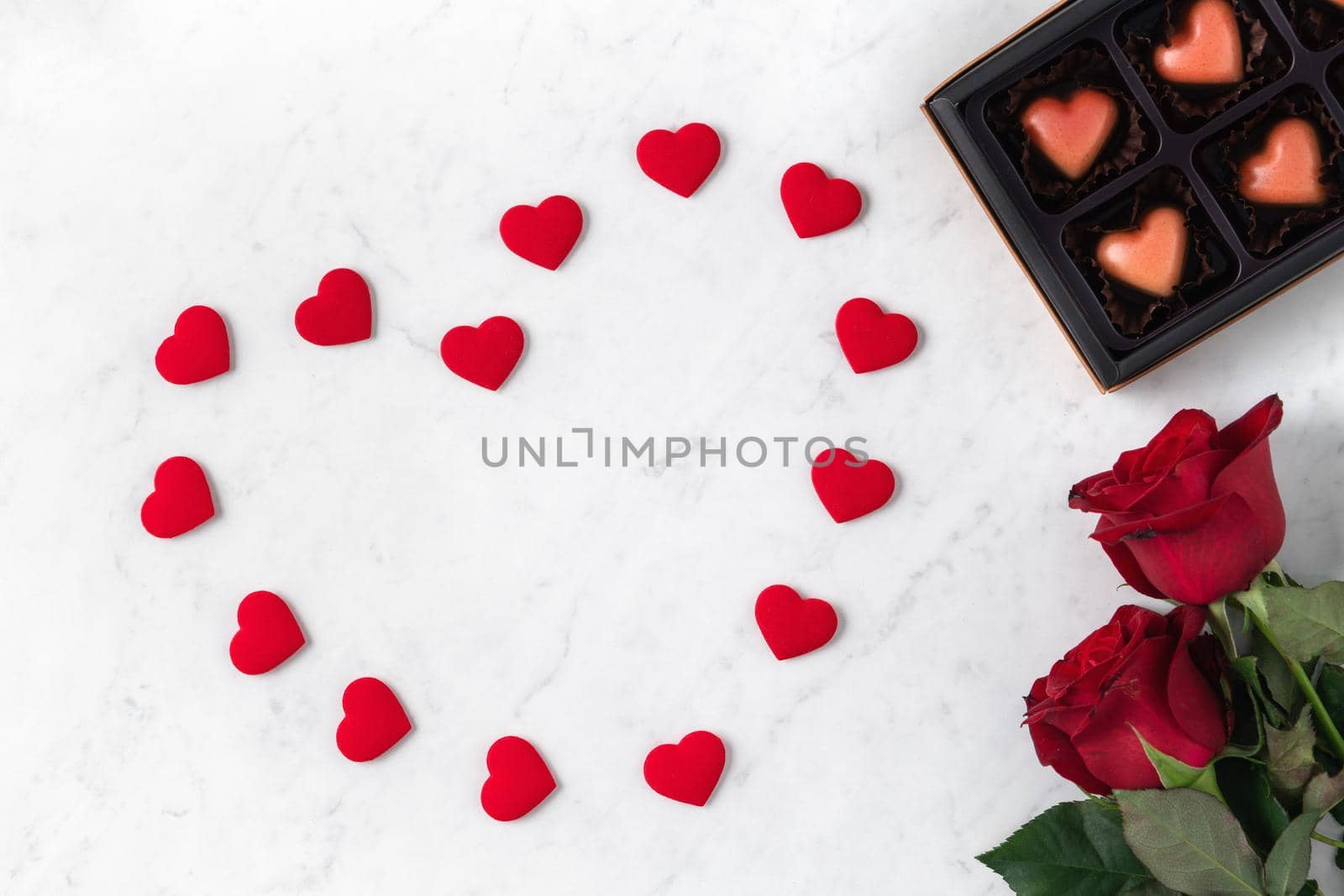 Top view of Valentine day chocolate with rose and wine, festive gift design concept for special holiday dating.