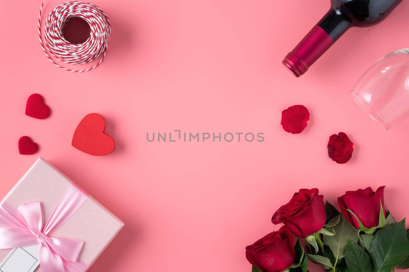 Valentine's Day design concept background with rose flower and gift box on pink background
