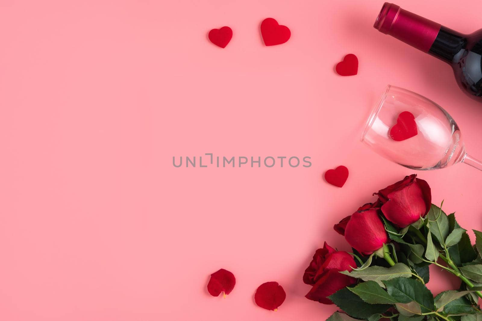 Valentine's Day dating gift with wine and rose concept on pink background design concept