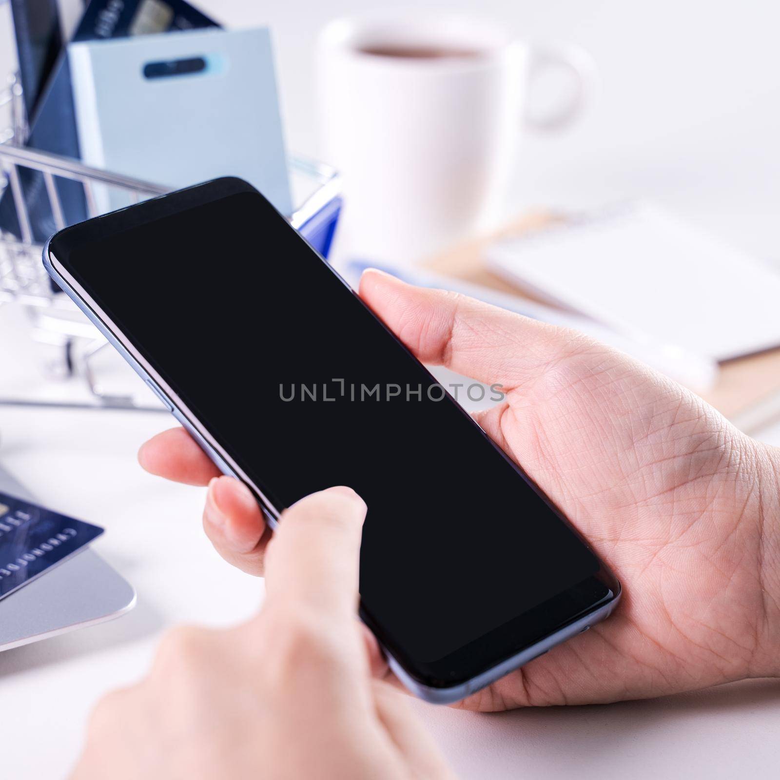 Woman using holding smart mobile phone staying home online electronic payment