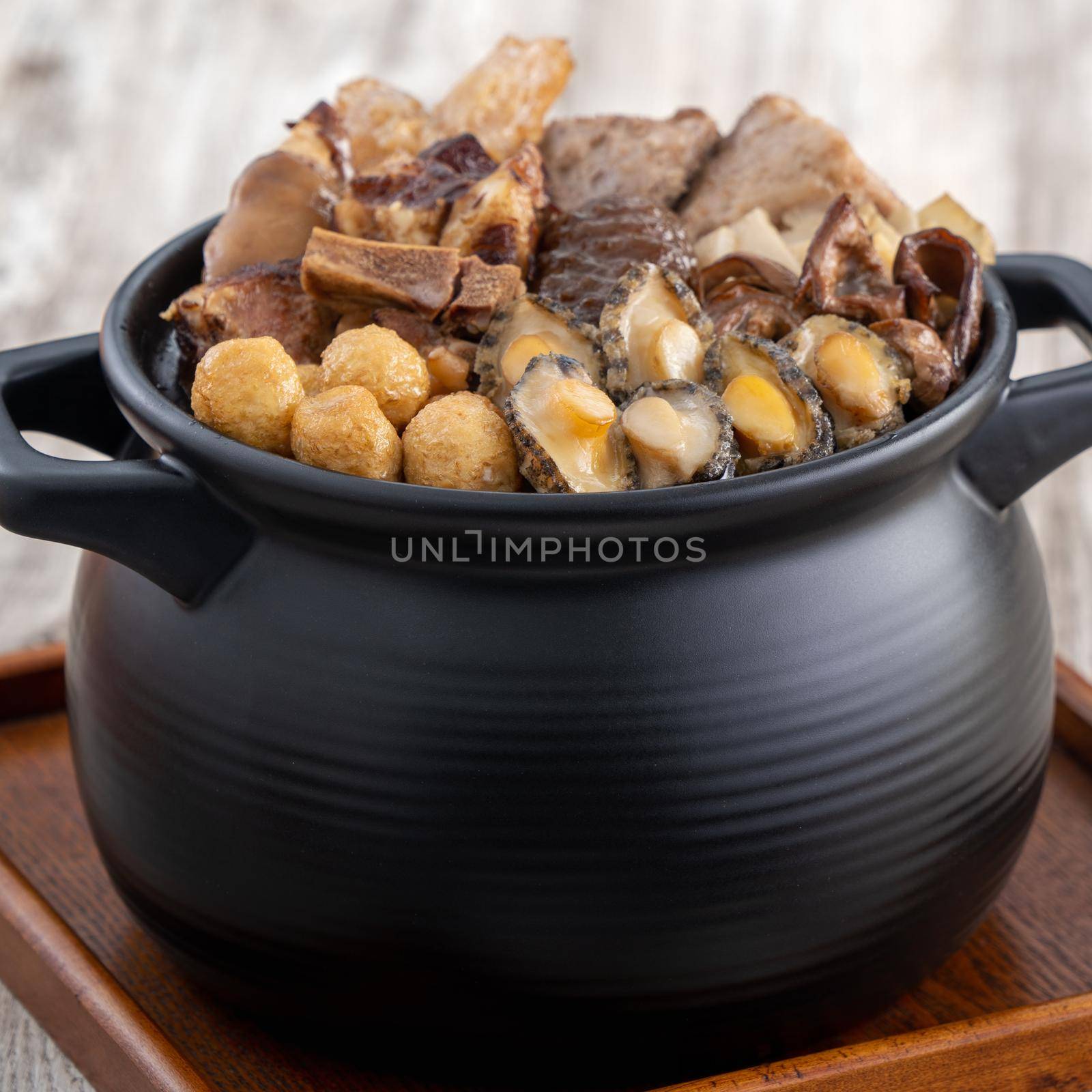 Traditional food of Chinese lunar new year, Buddha jumps over the wall, Chinese Soup Casserole dish, Buddha's Temptation, named Fo Tiao Qiang, close up.