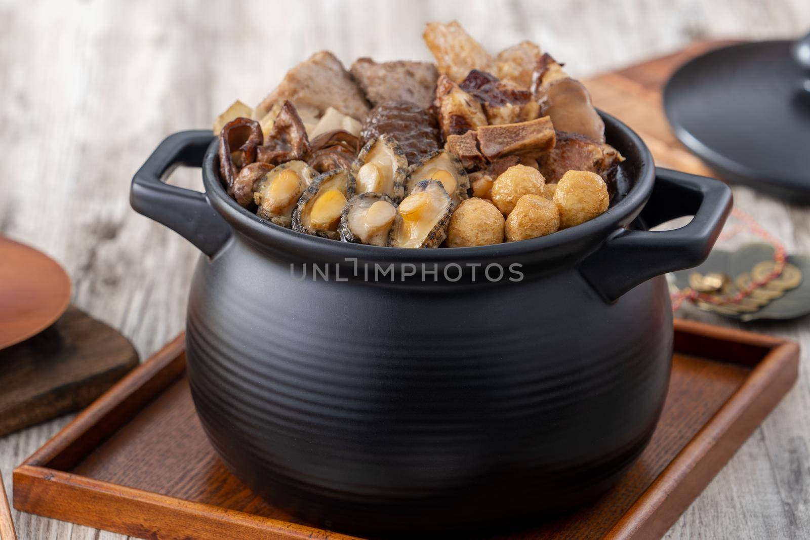 Traditional food of Chinese lunar new year, Buddha jumps over the wall, Chinese Soup Casserole dish, Buddha's Temptation, named Fo Tiao Qiang, close up.