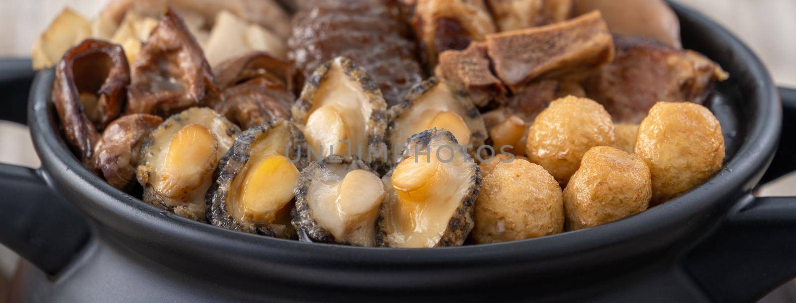 Traditional food of Chinese lunar new year, Buddha jumps over the wall, Chinese Soup Casserole dish, Buddha's Temptation, named Fo Tiao Qiang, close up.
