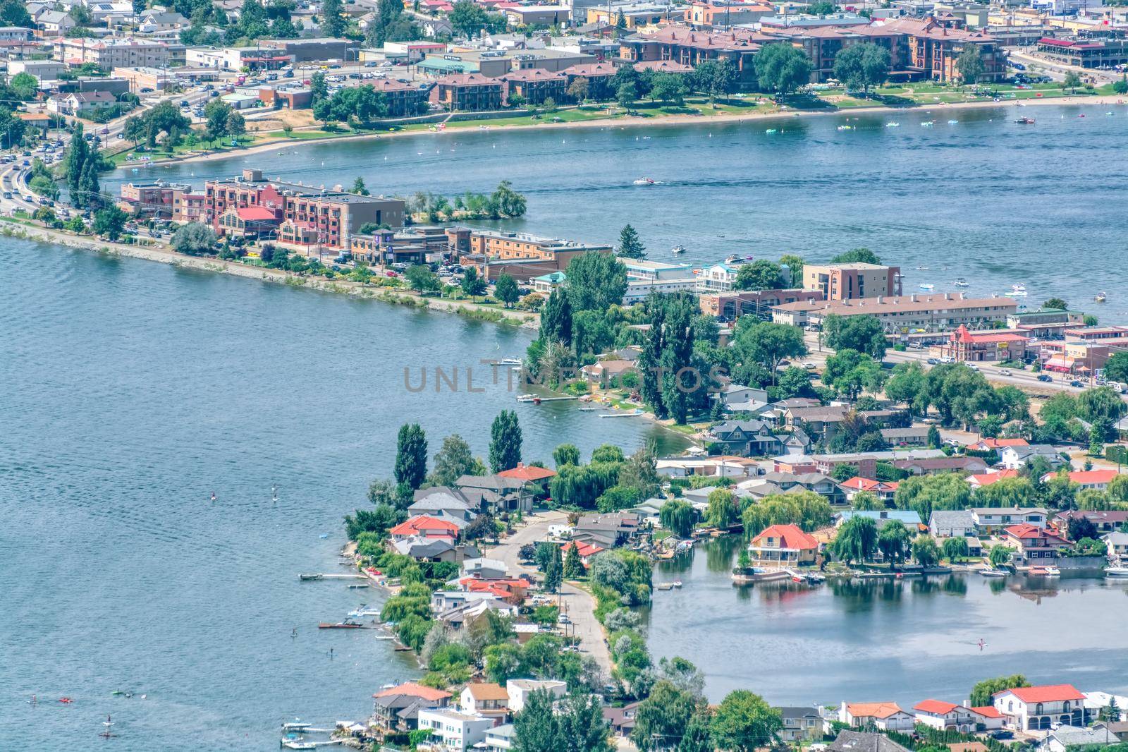 Fly overview of resort area and residential houses in Osoyoos town, British Columbia