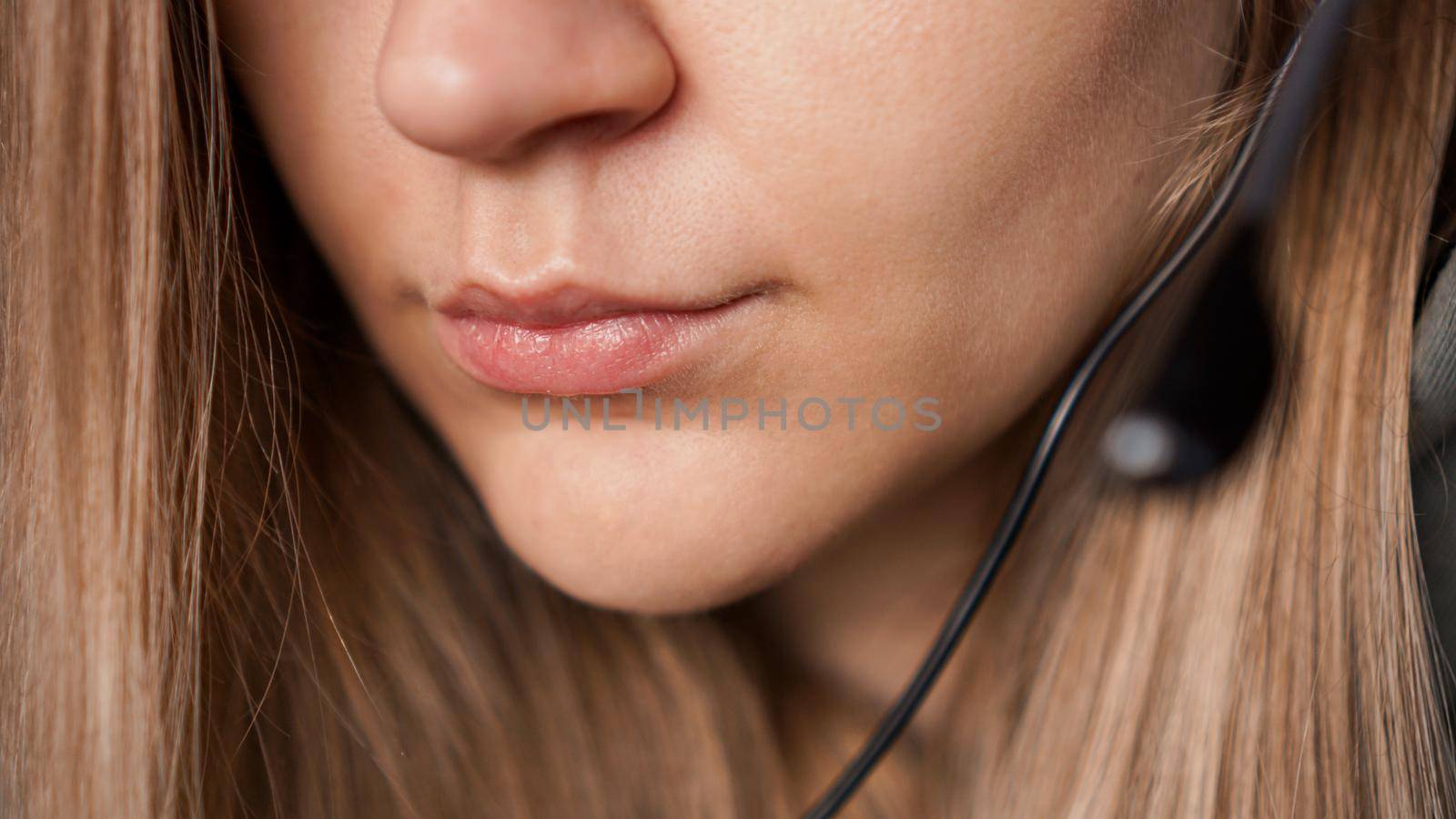 Closeup portrait of female lips and black headset. Call center by natali_brill
