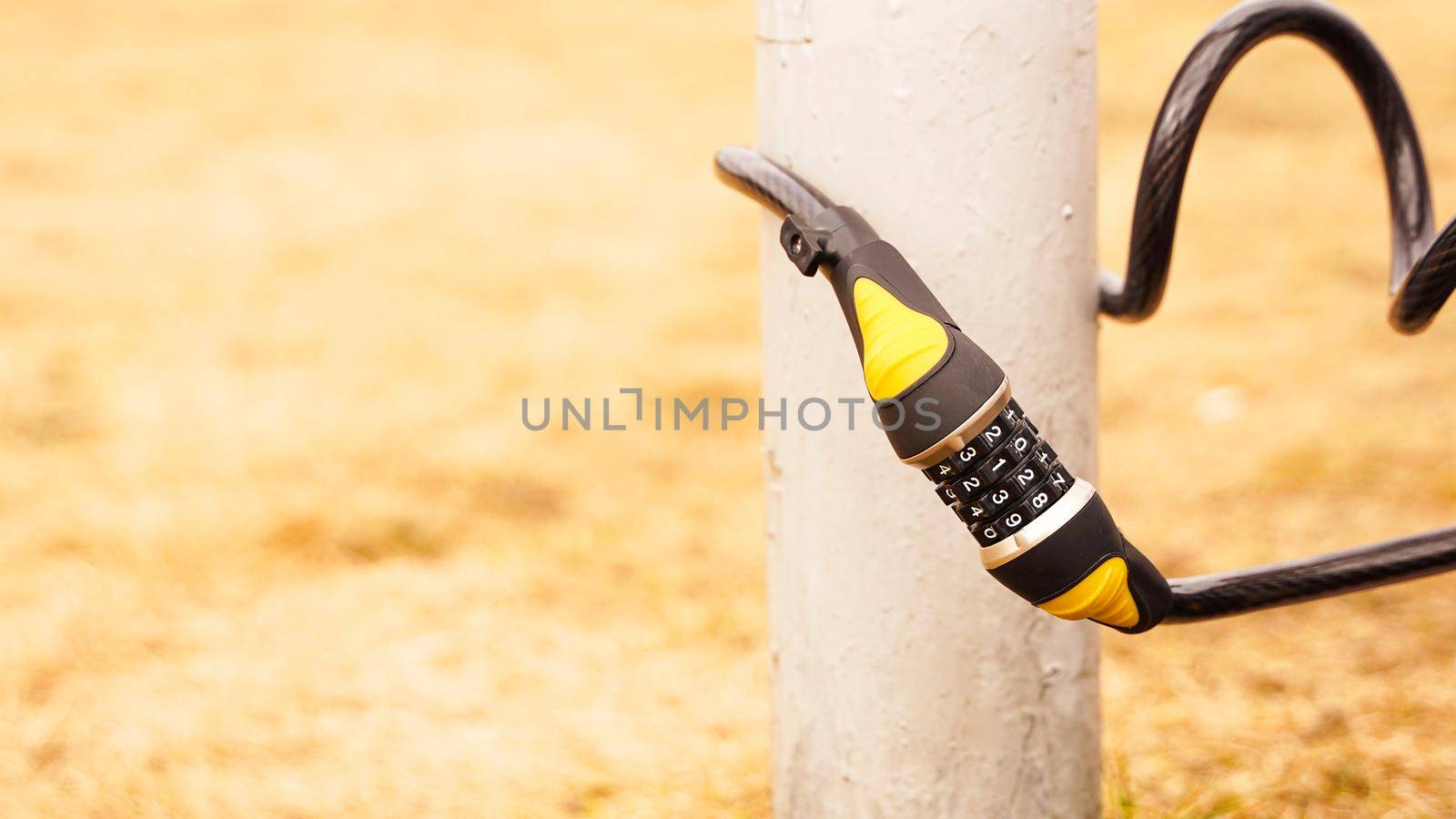 Combination lock near the post. Protection against theft of bicycles, scooters.