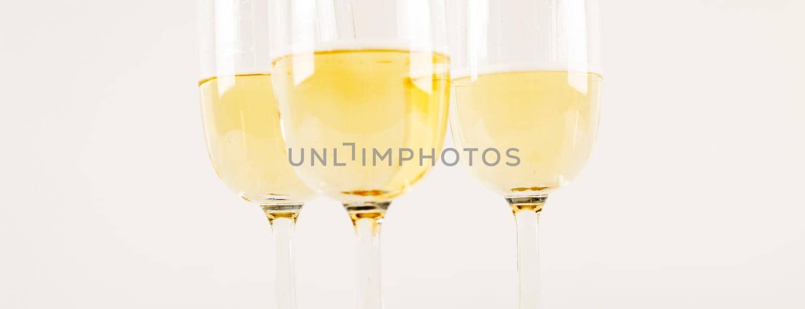 luxurious champagne in a glass, festive way of celebrating a new year or important events, toast with sparkling wine by Q77photo