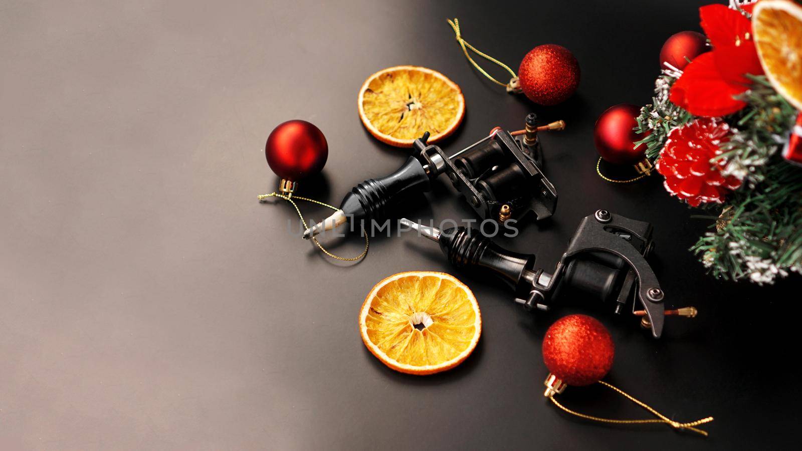 Tattoo machines on a christmas background - christmas decor by natali_brill