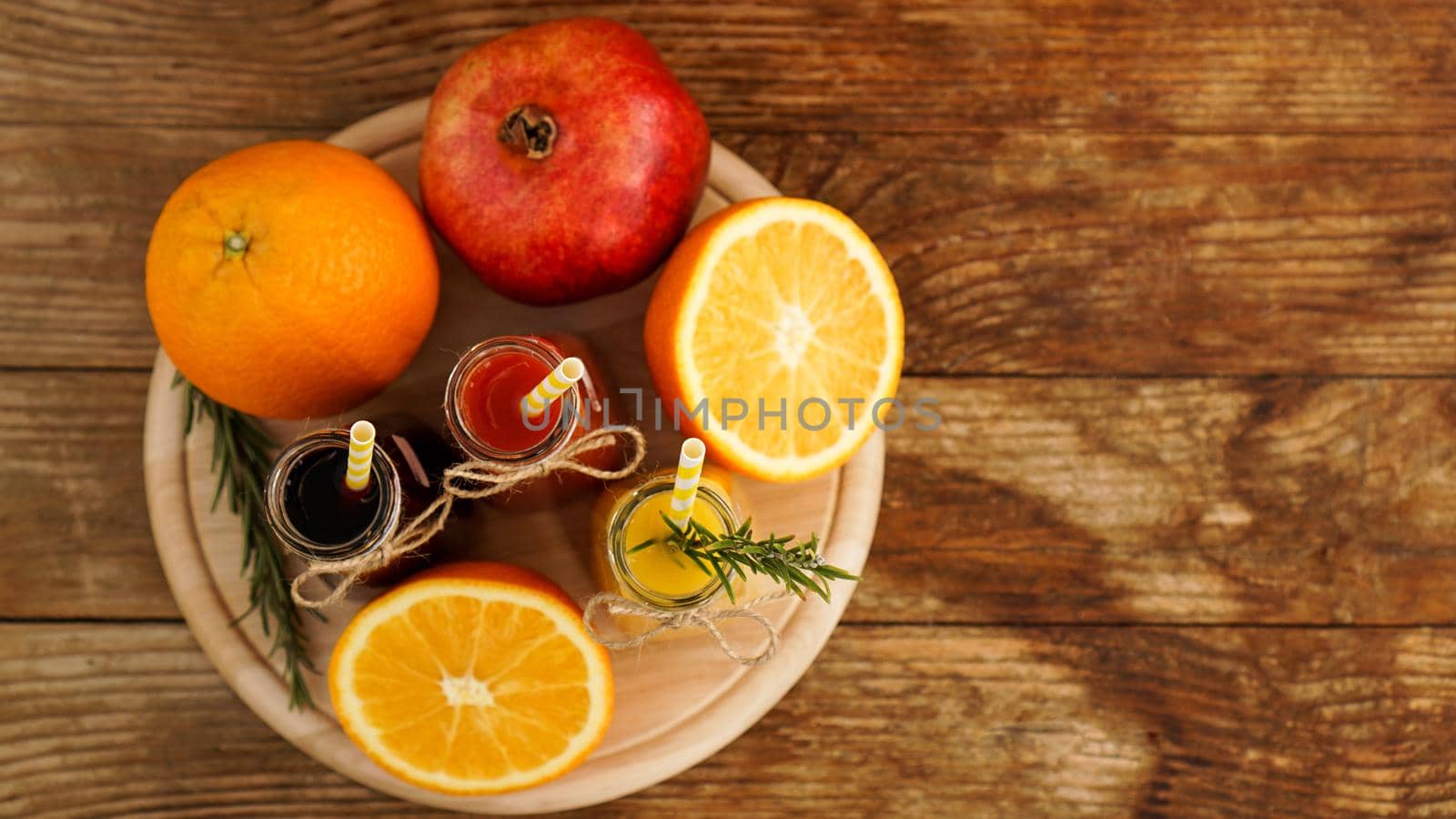 Home made lemonade in little bottles. Multicolored juices and fruits by natali_brill