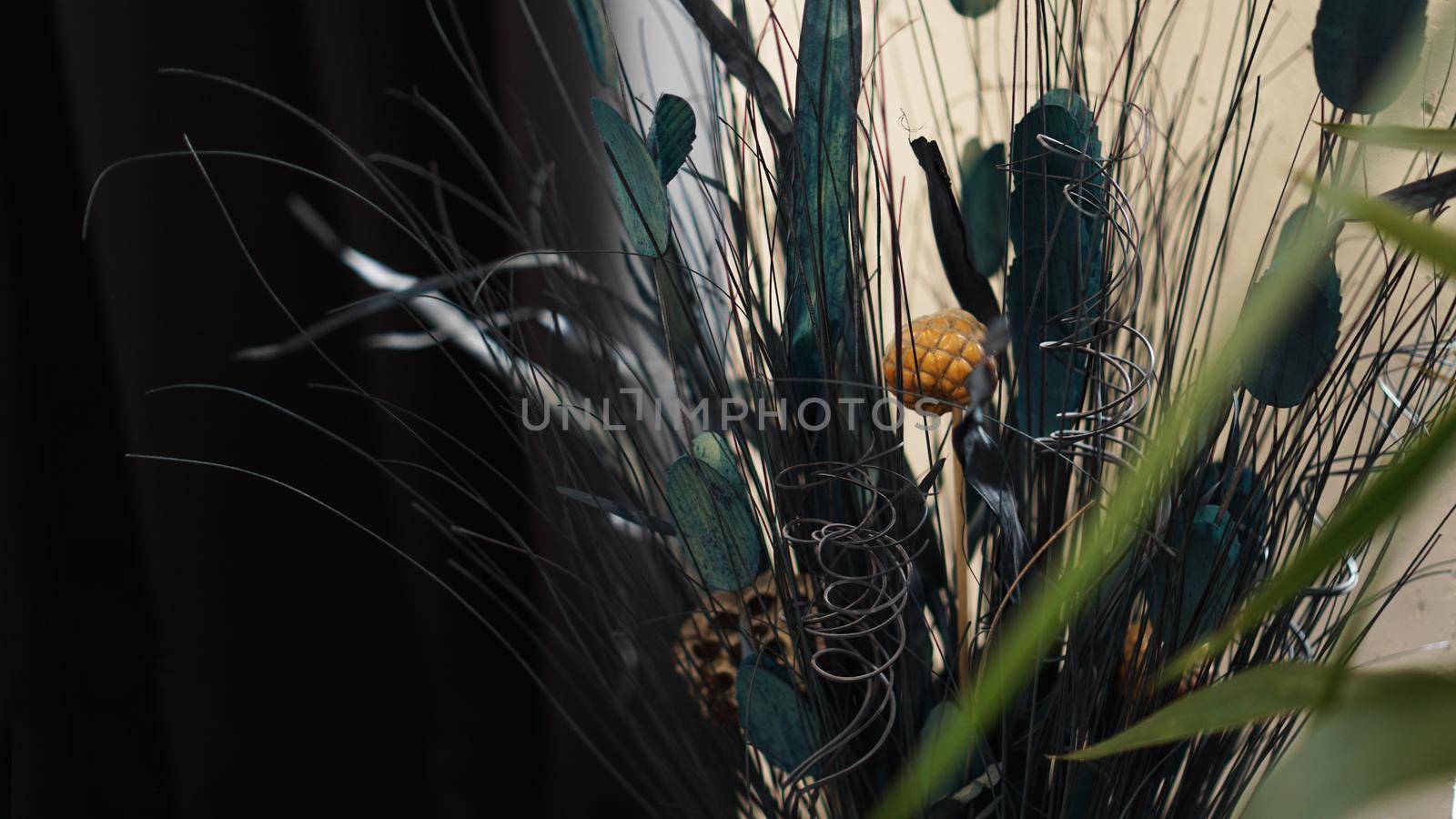 Beautiful and delicate bouquet of dried flowers in interior. Decorations for the room