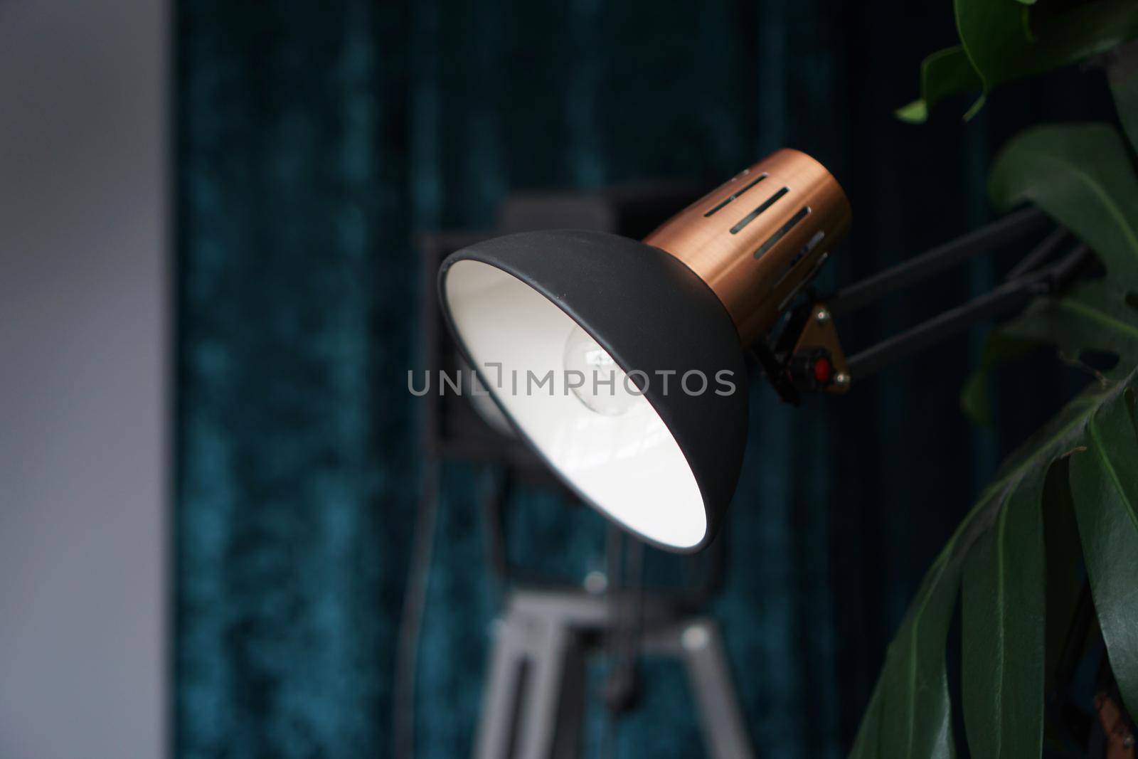 Photo studio lighting equipment on black and blue background indoor