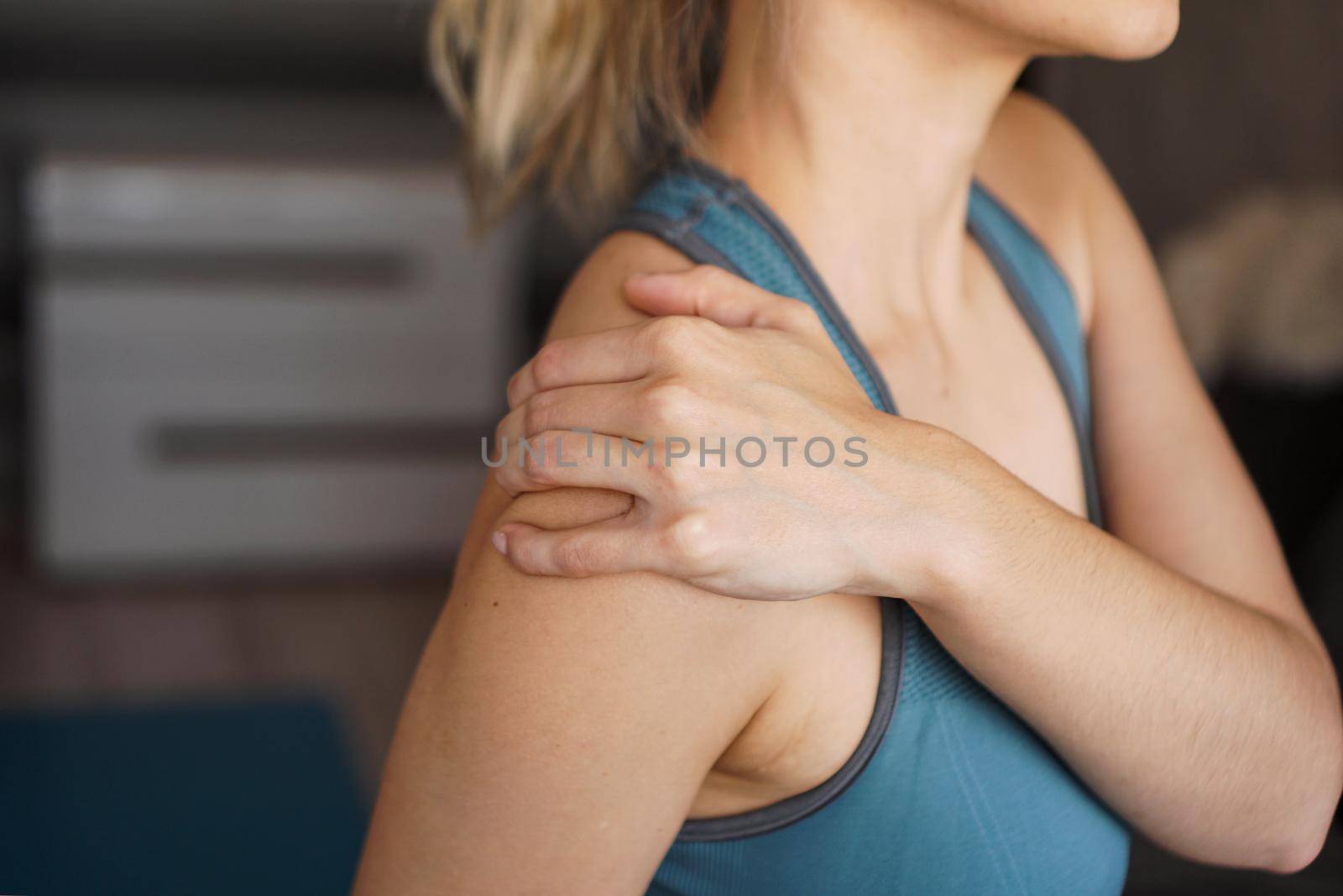 Closeup on fitness woman having pain in shoulder by natali_brill