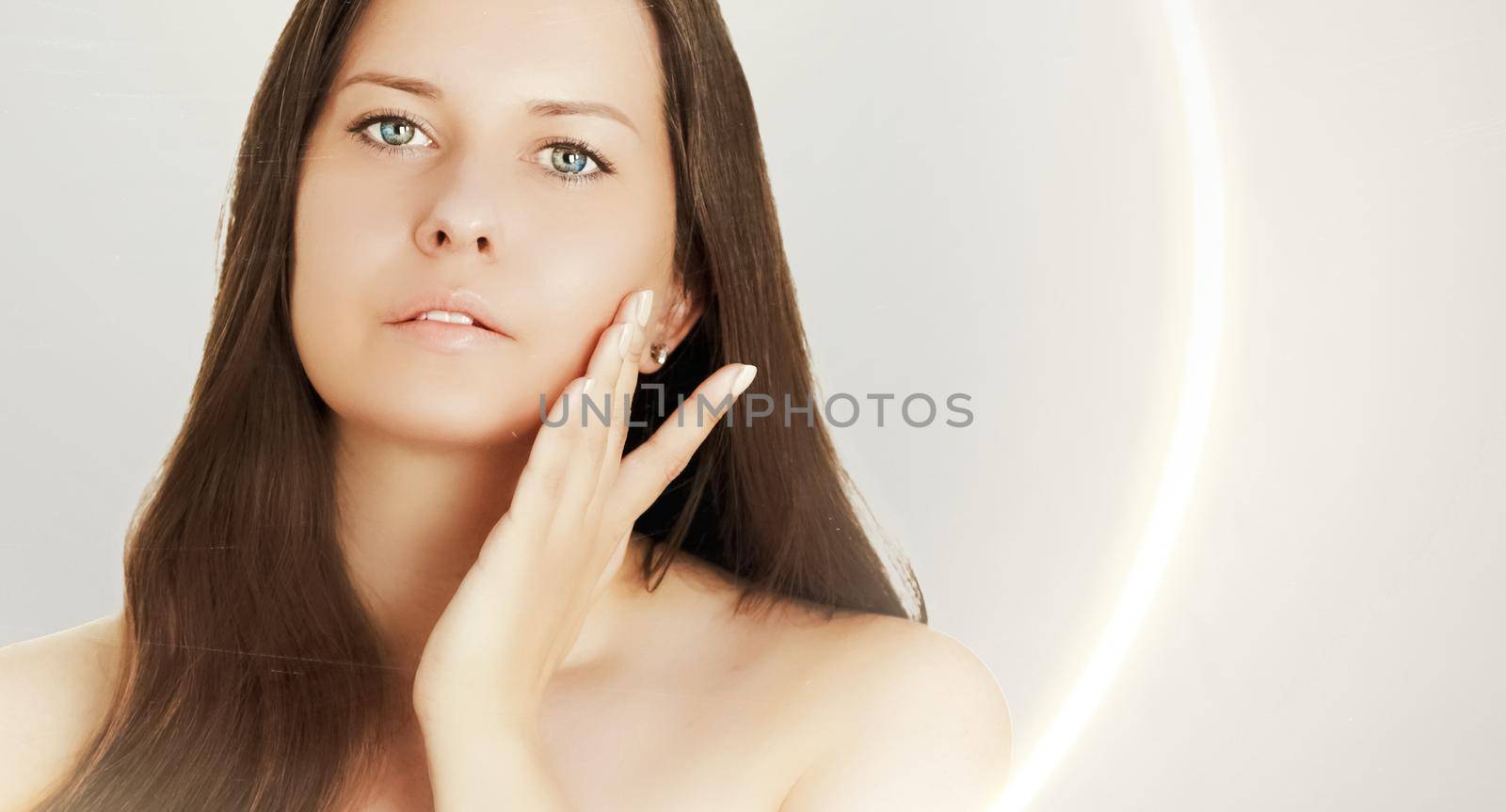 Suntan skin tone and beauty routine. Beautiful brunette female model with natural tan, face portrait of young woman.