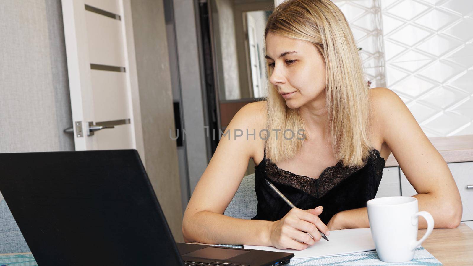 Entrepreneur or student working or studying at home and writing notes by natali_brill