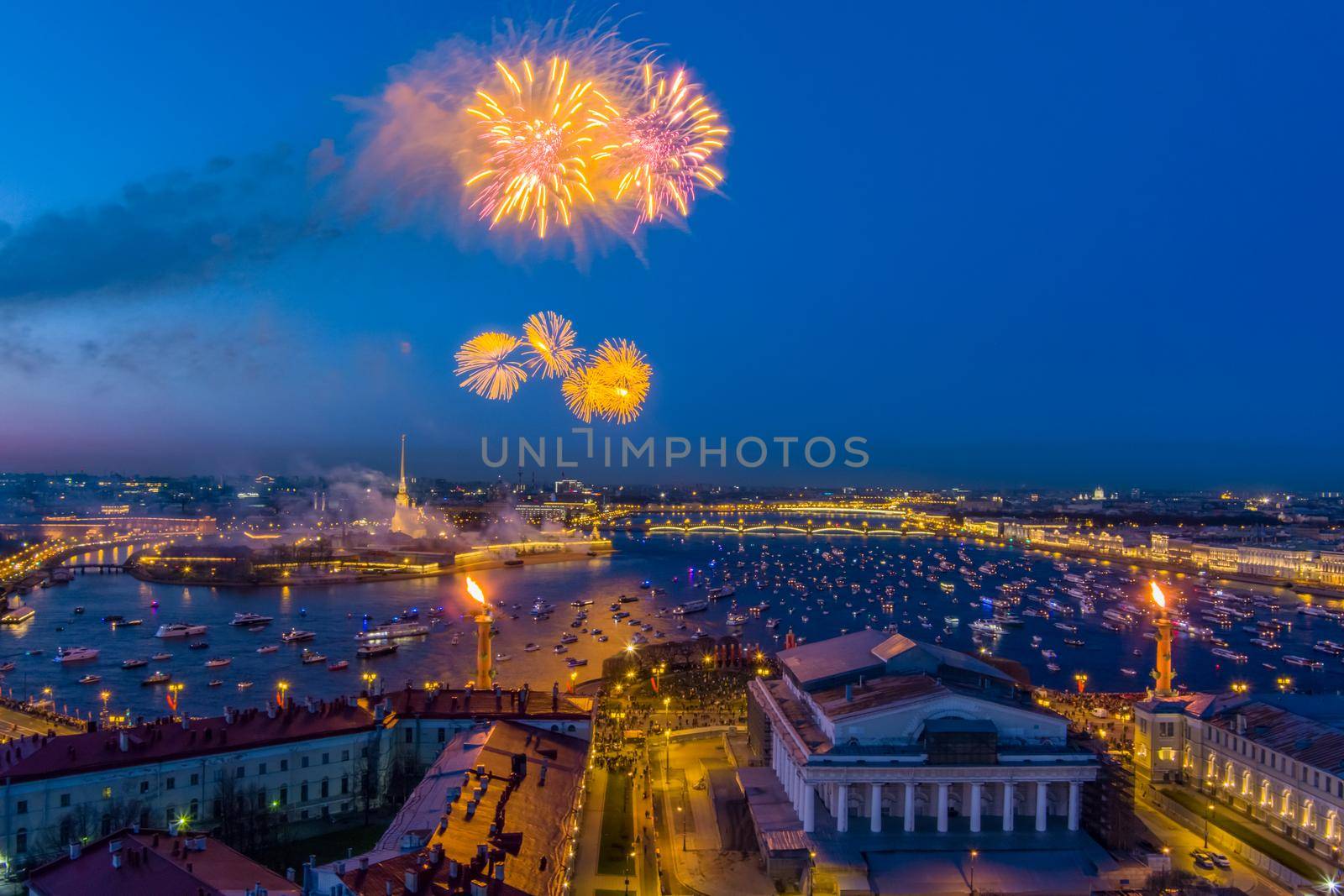 Festive salute over the Peter and Paul Fortress in a significant Victory Day for the country on May 9, improbable quantity of ships observes a show, an eternal flame of memory burns on rostral colons. High quality 4k footage