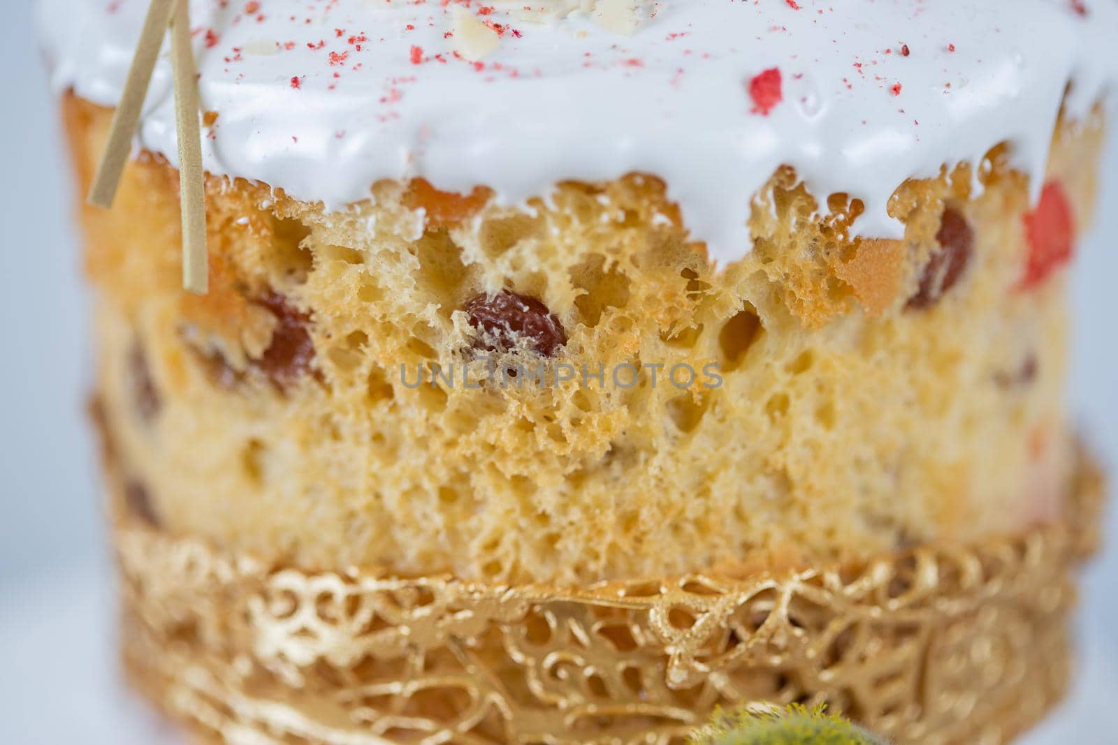 Close-up of an Easter cake. The porous surface of the cake made from yeast dough on a white background