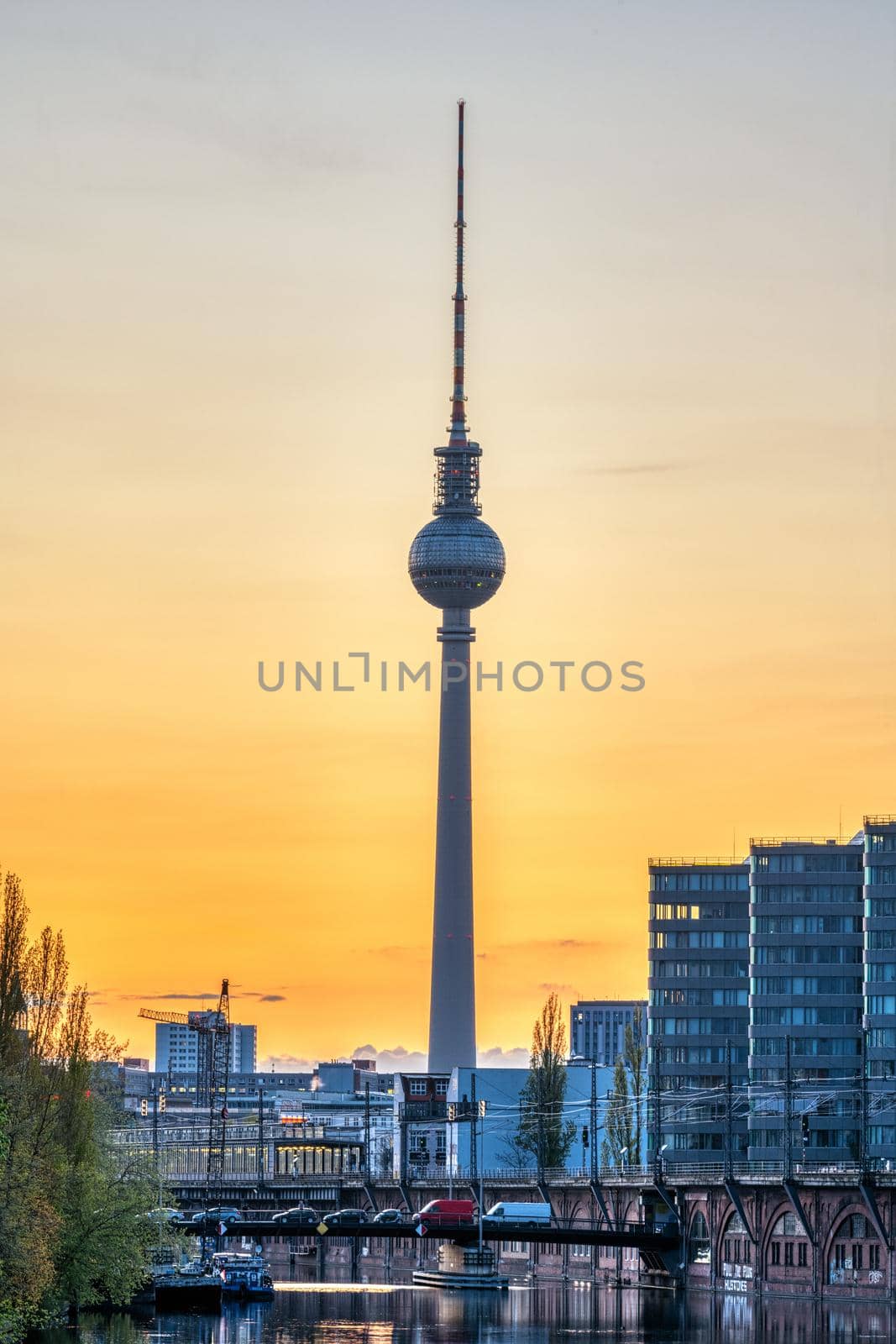 The famous Television Tower and the river Spree in Berlin at sunset