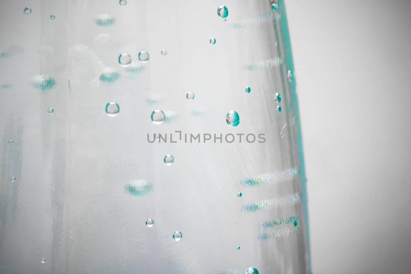 Plastic water bottle with bubbles close up by Vera1703