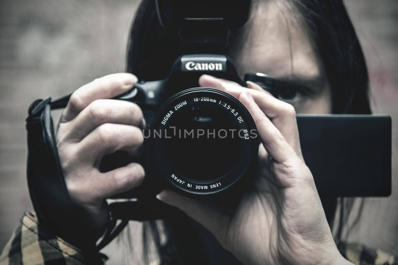 EDITORIAL, BELARUS - 25 JANUARY, 2019: Photographer with canon camera close up