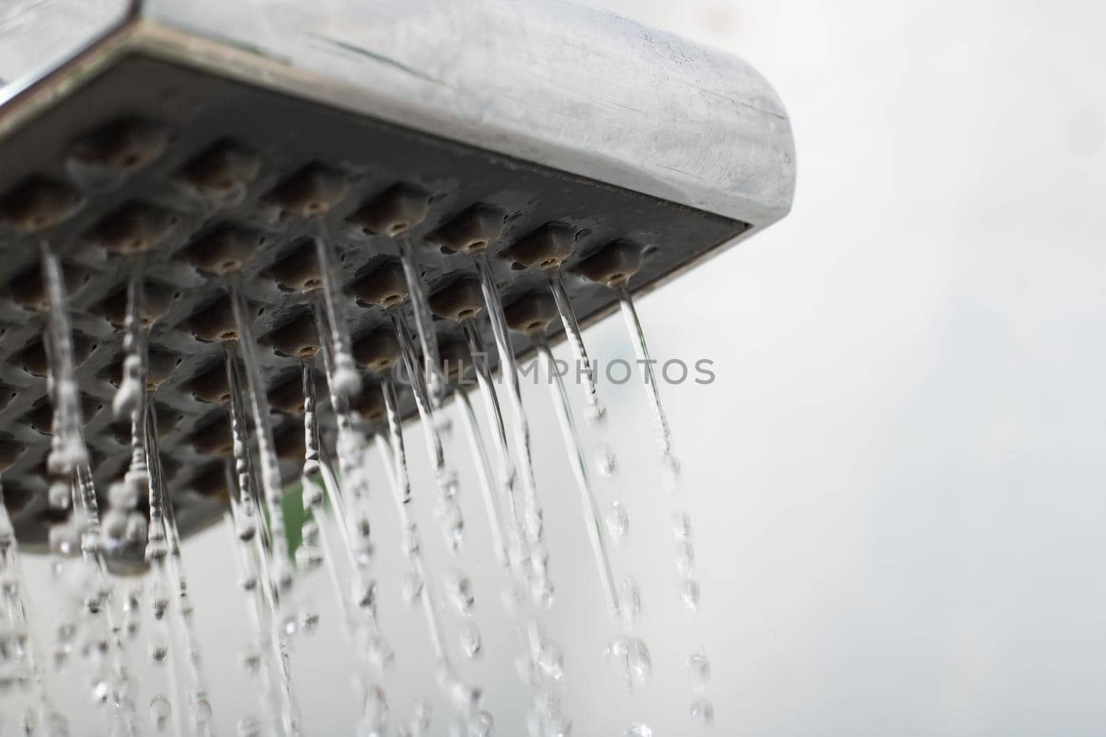 Close up of water drops from a shower, copy space