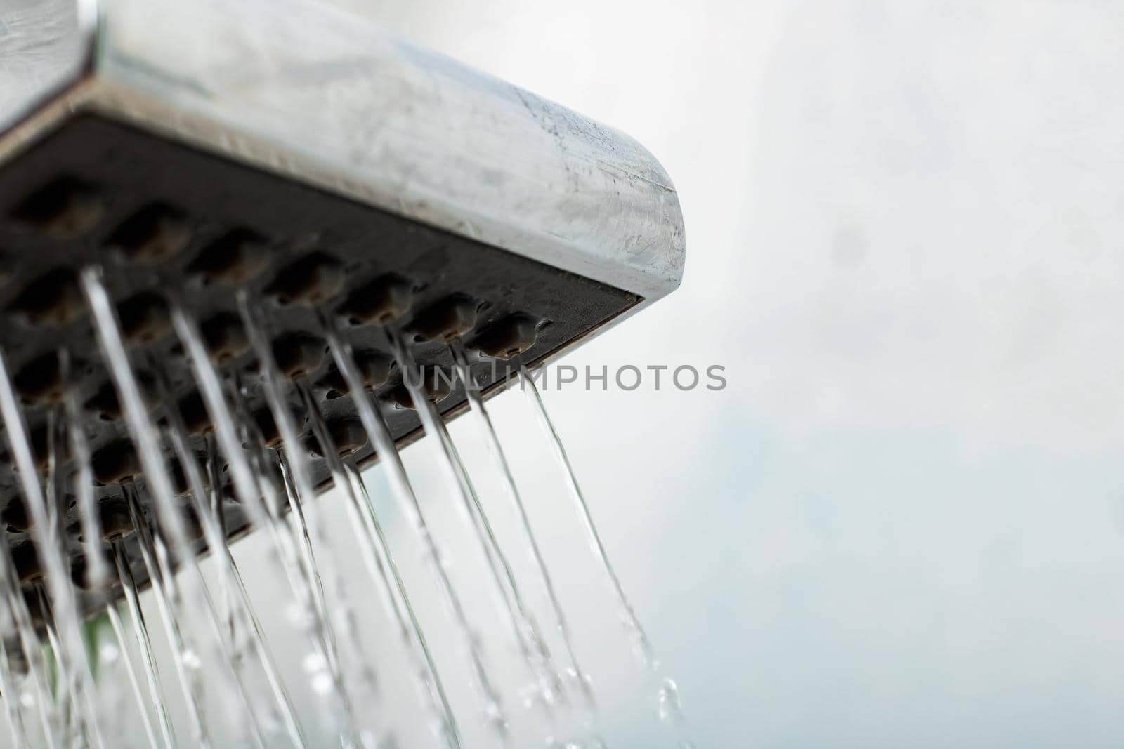 Close up of water drops from a shower, copy space