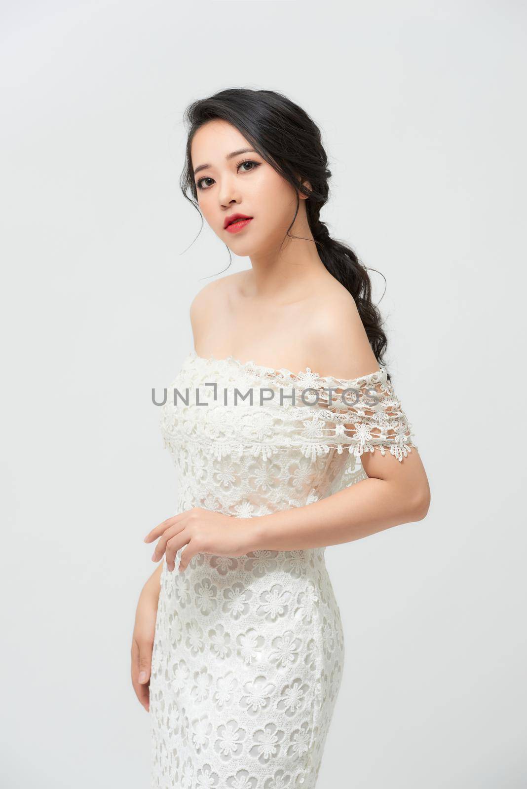 Gorgeous, asian bride in white luxury dress