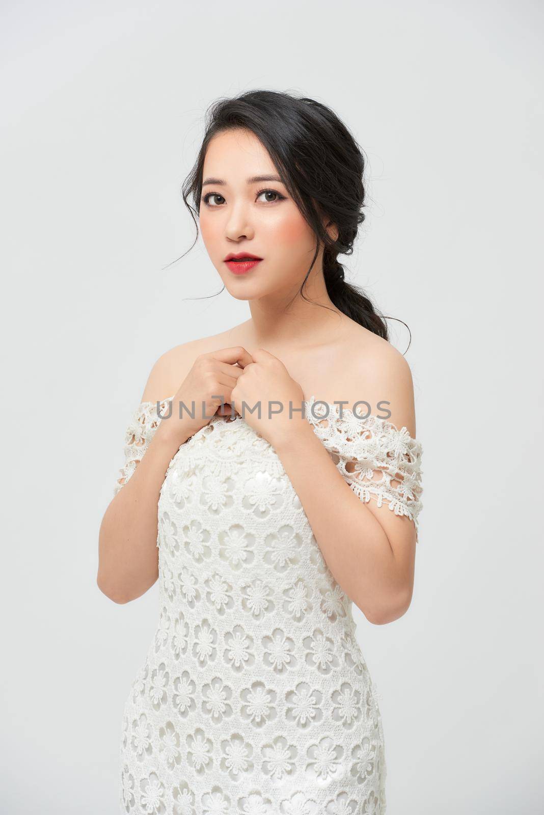 A beautiful girl with great figure in the white lace wedding dress by makidotvn