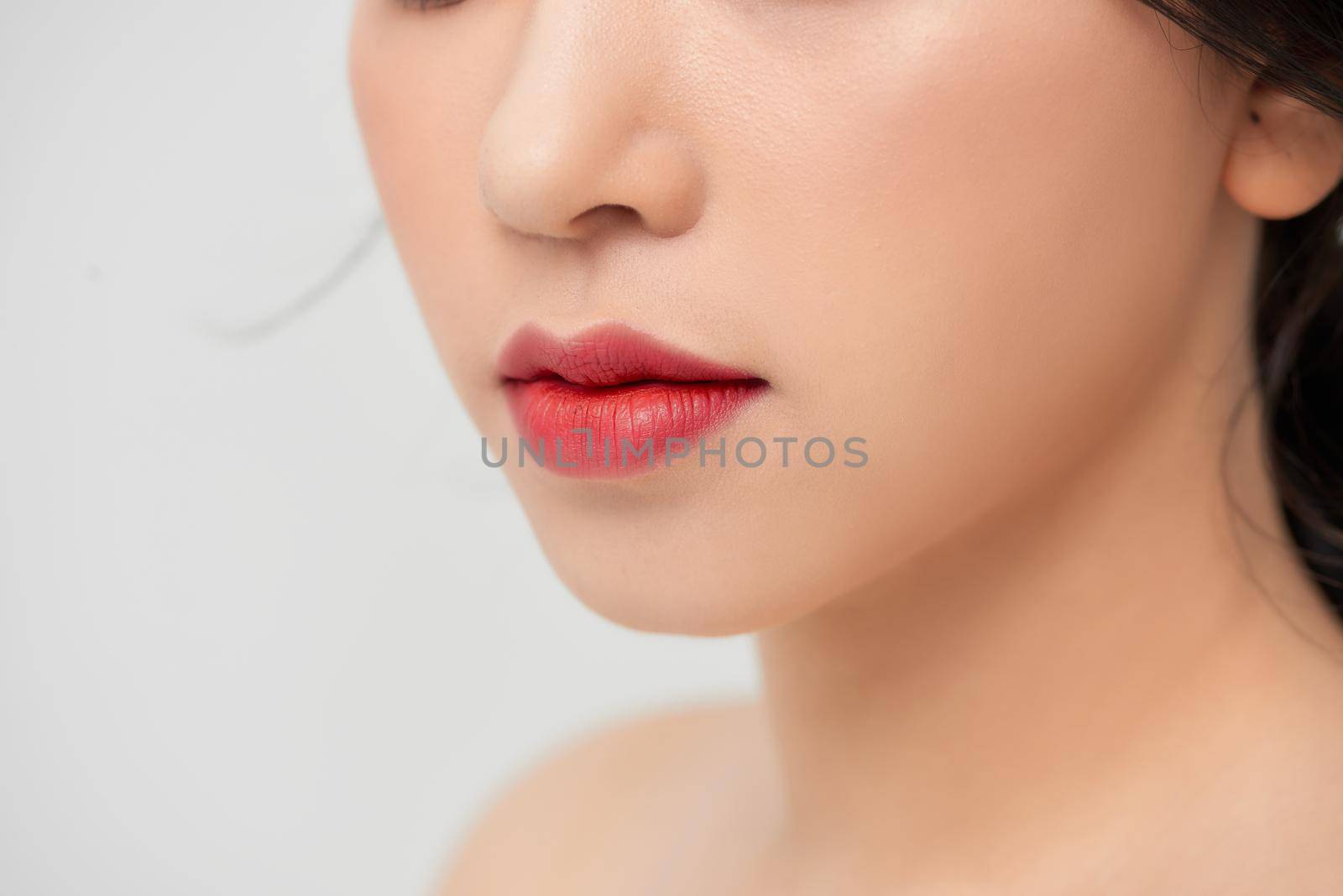 Close-up shot of woman lips with red lipstick. Beautiful perfect lips. Sexy mouth close up. Beautiful wide smile of young fresh woman with full lips by makidotvn