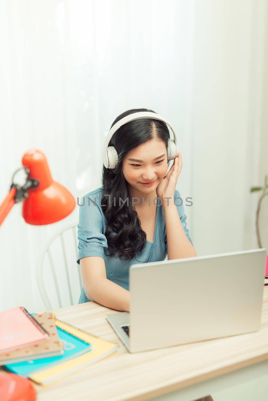 Smart asian  girl desk work remote laptop watch seminar drink beverage mug in house indoors by makidotvn