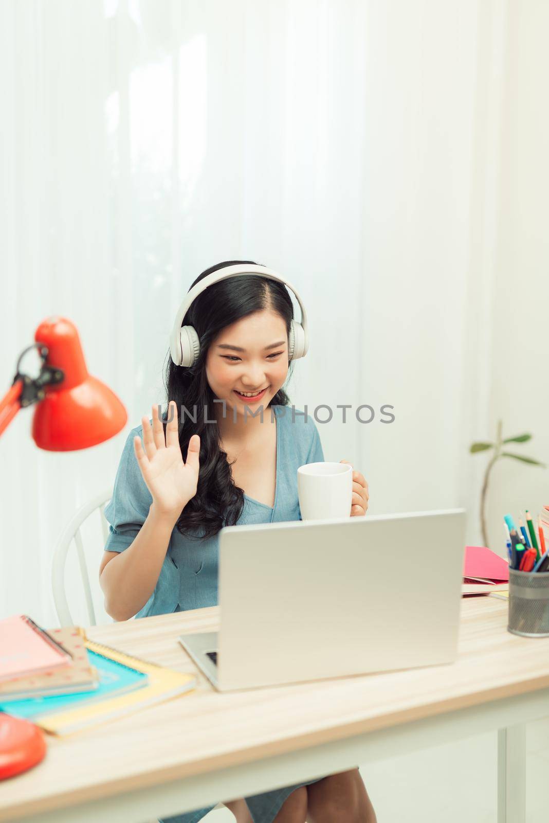 Young lady student browsing notebook sit desktop video call listen lesson online webinar conference education social distance quarantine indoors by makidotvn
