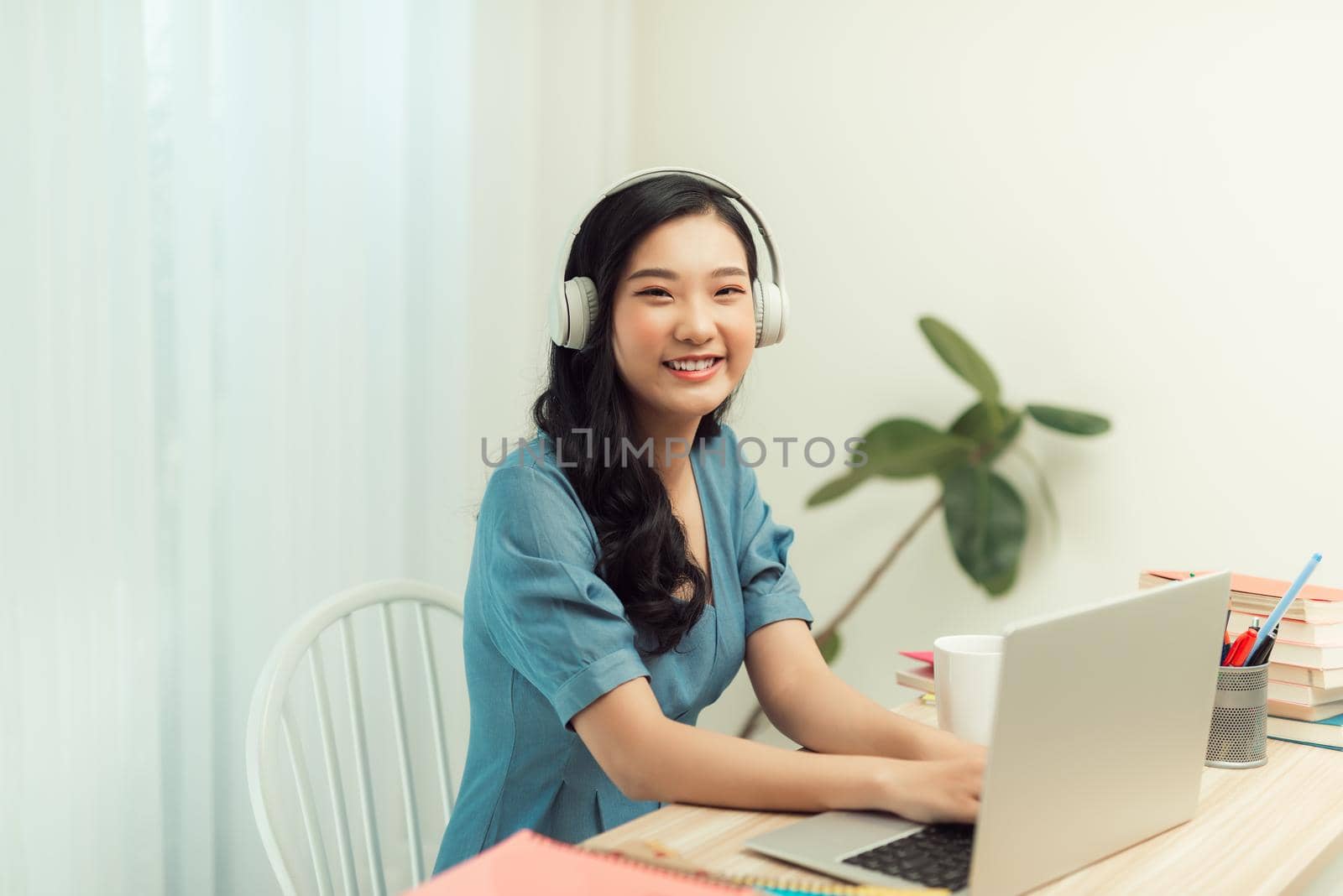 Young lady student browsing notebook sit desktop video call listen lesson online webinar conference education social distance quarantine indoors