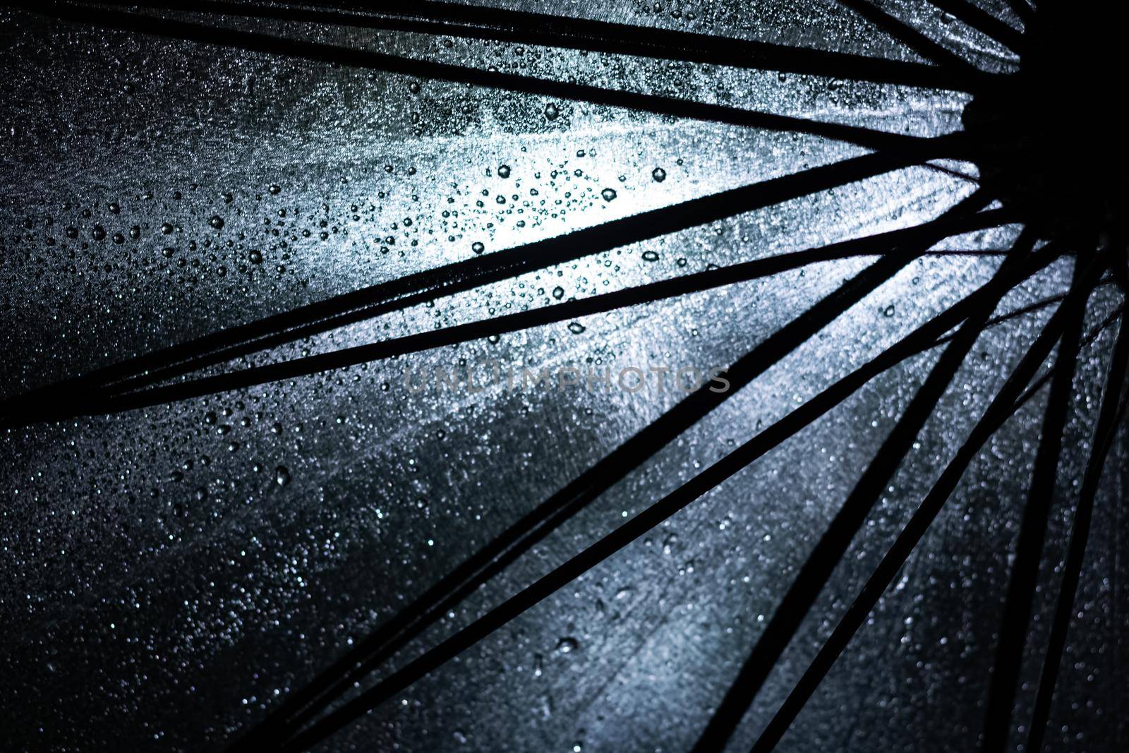 Big black umbrella bottom view close up, abstract background or texture