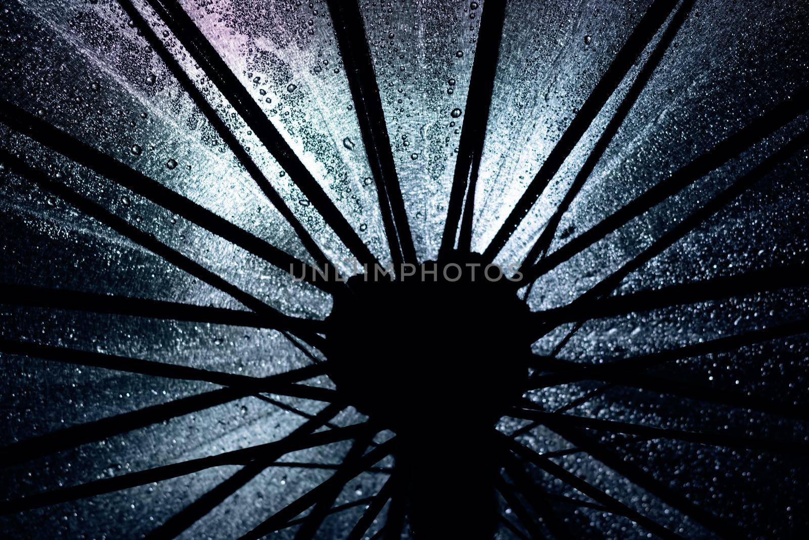 Big black umbrella bottom view close up, abstract background or texture