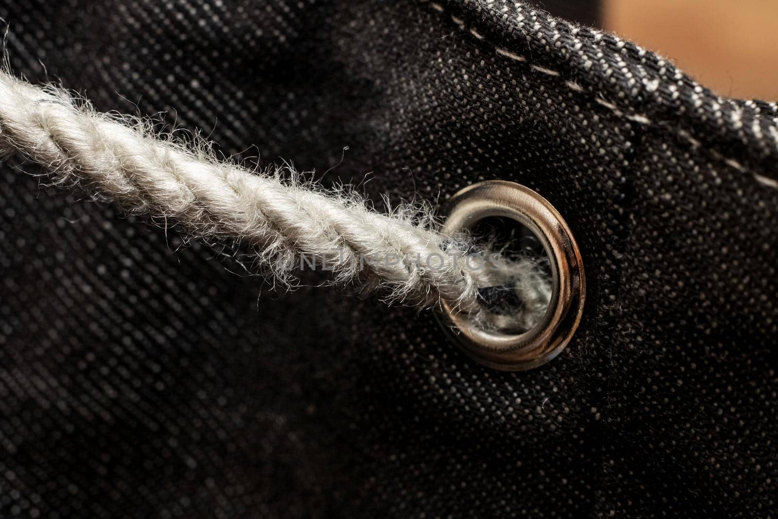 Buckle on a gray denim backpack close up by Vera1703