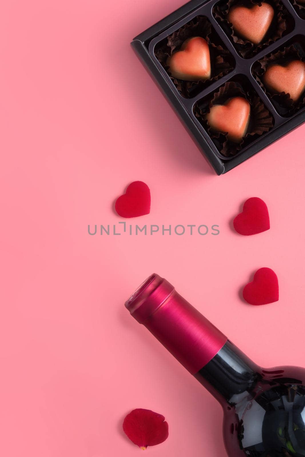 Valentine's Day dating gift with wine and rose concept on pink background design concept