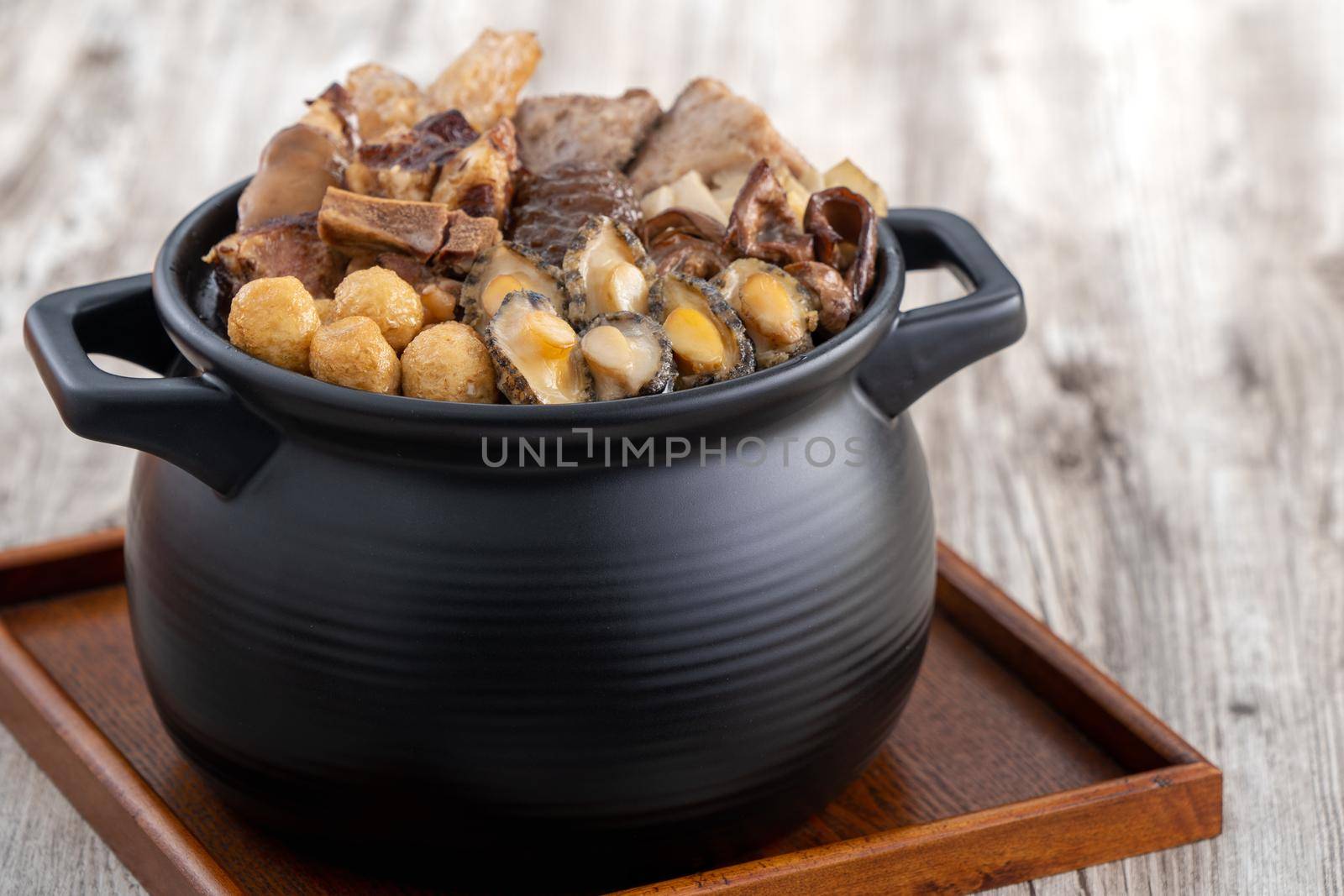 Traditional food of Chinese lunar new year, Buddha jumps over the wall, Chinese Soup Casserole dish, Buddha's Temptation, named Fo Tiao Qiang, close up.