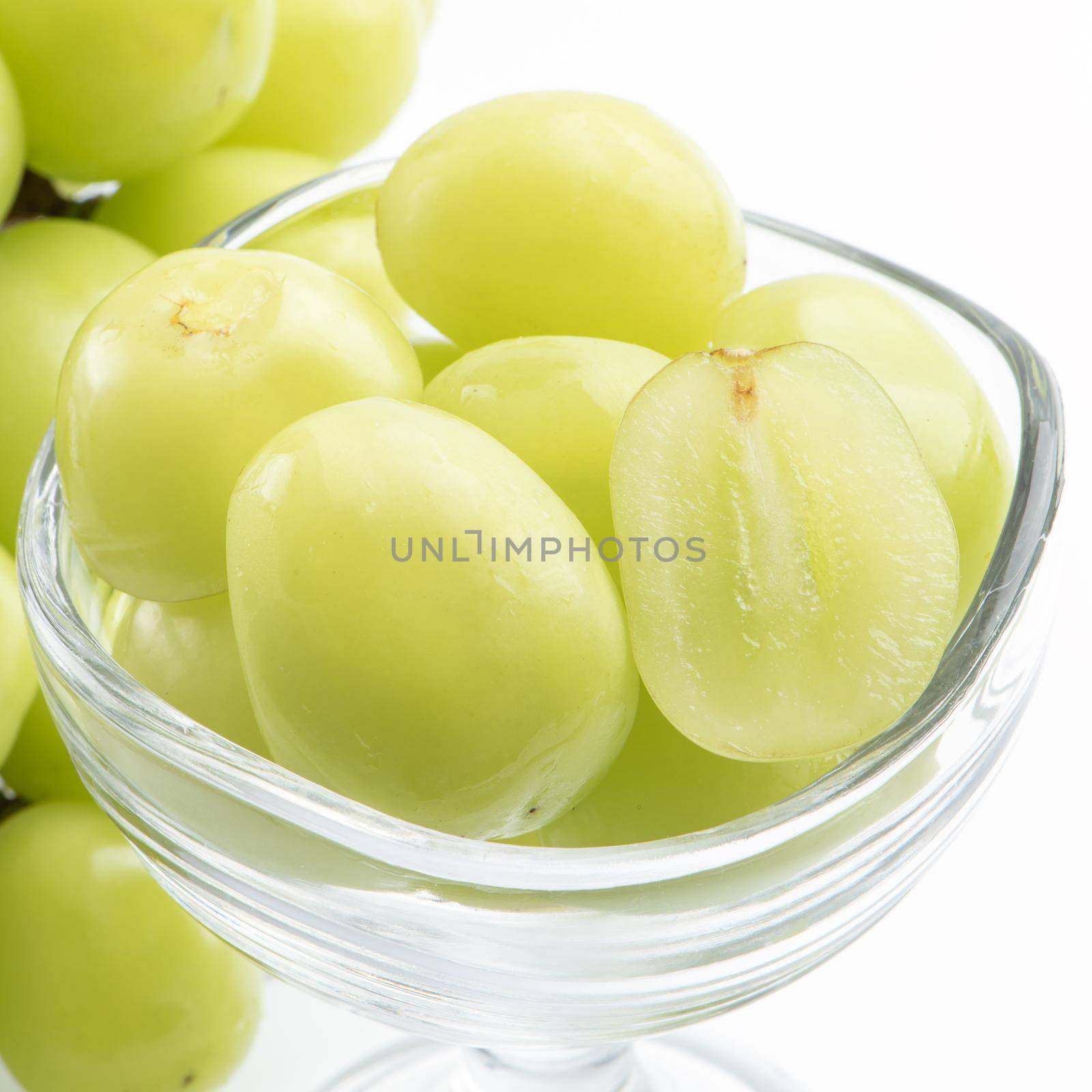 Close up of beautiful boxed Shrine Muscat green grape isolated on white background, clipping path cut out.