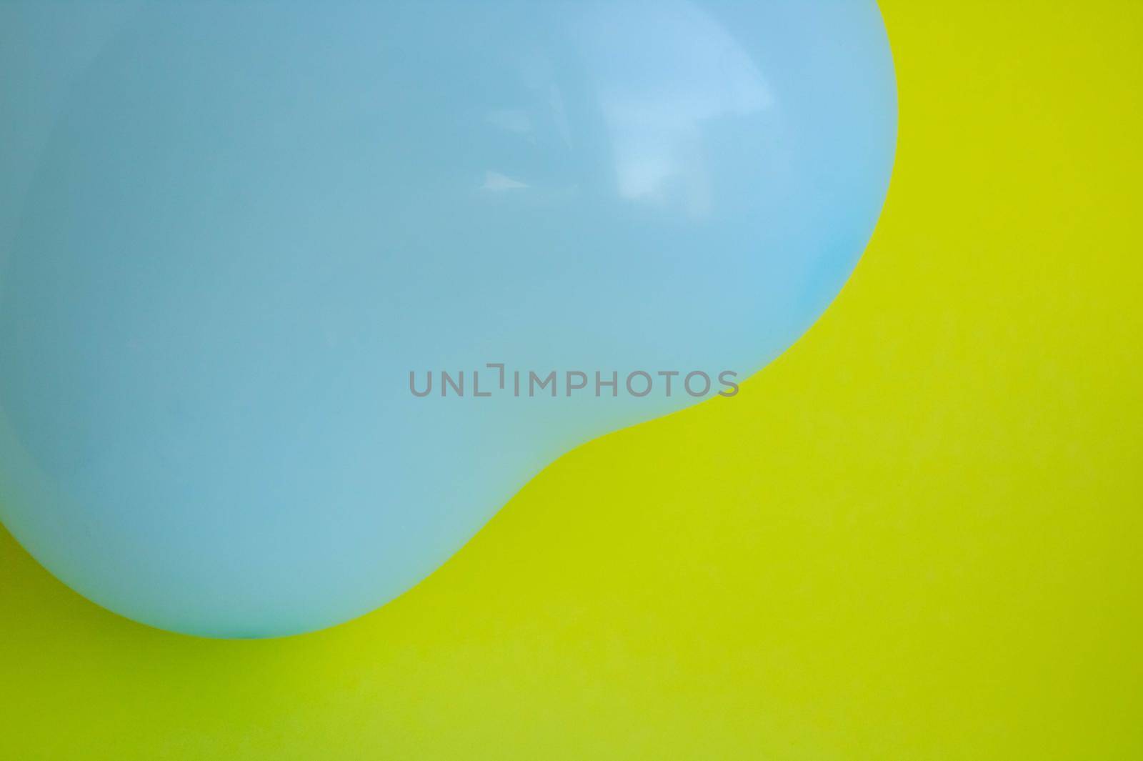 Blue balloon in the shape of a heart on a yellow background. Wedding concept, Valentine's Day, photo zone, lovers. Banner. top view.