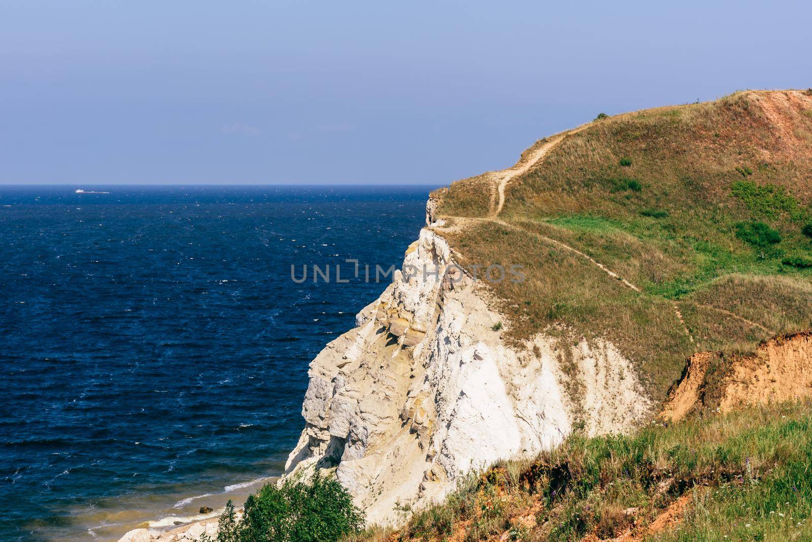 Landscape of a dolomite cliff with hiking trail on the edge