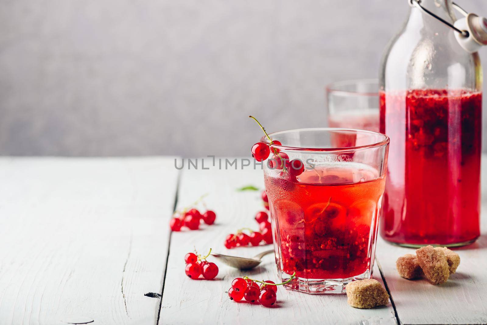Infused water with fresh red currant and cane sugar