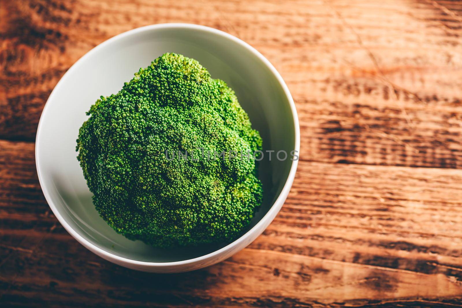 Head of broccoli in bowl by Seva_blsv