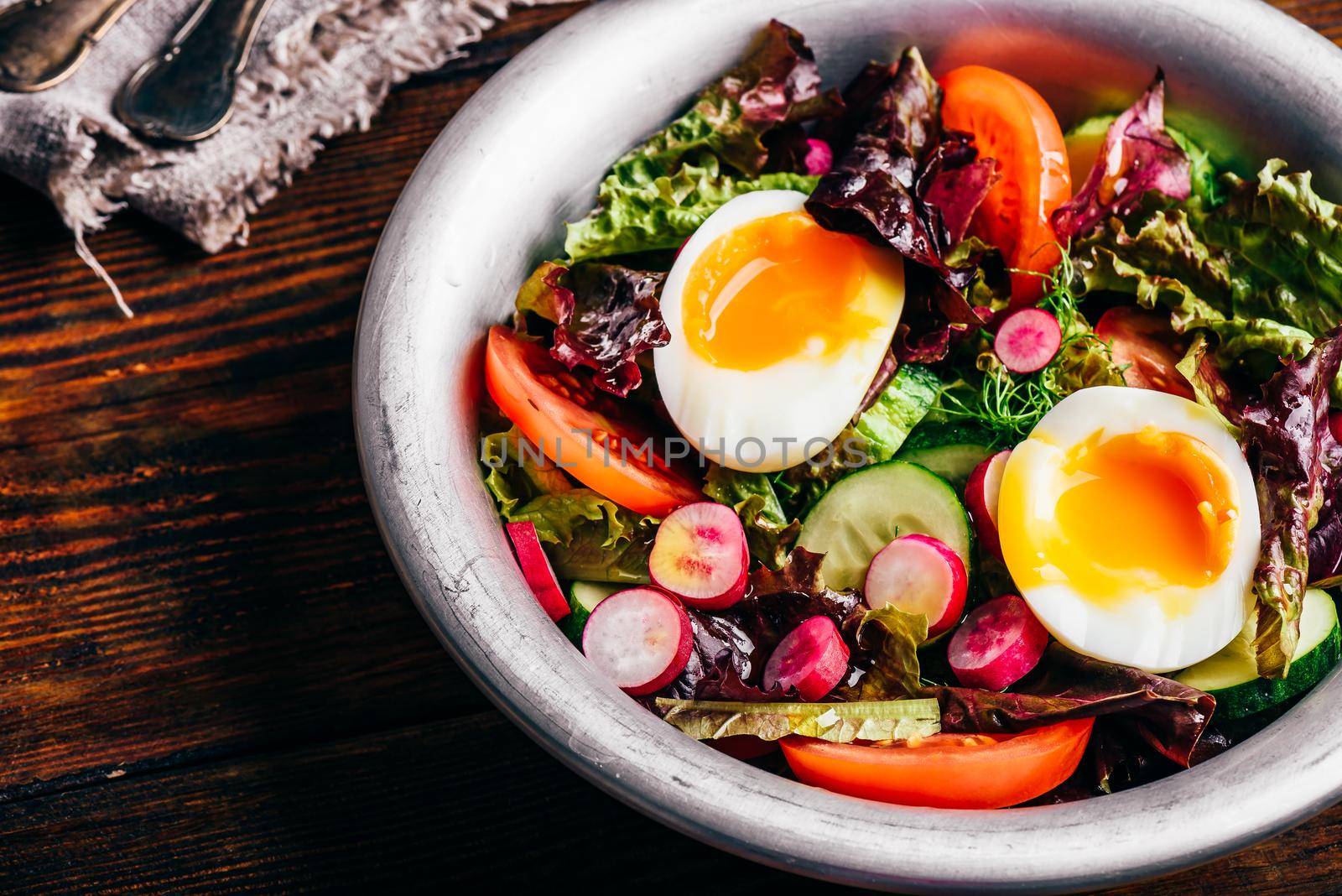 Fresh spring salad with homegrown vegetables and boiled eggs by Seva_blsv