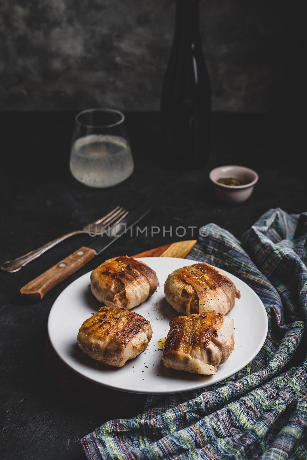 Bacon-wrapped button mushrooms stuffed with grated cheddar cheese and spices