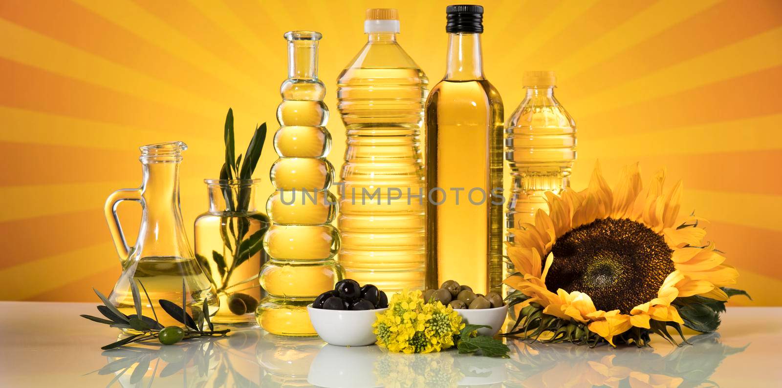 Cooking oils, Olive oil, Rape, Sunflower flowers in bottles by JanPietruszka