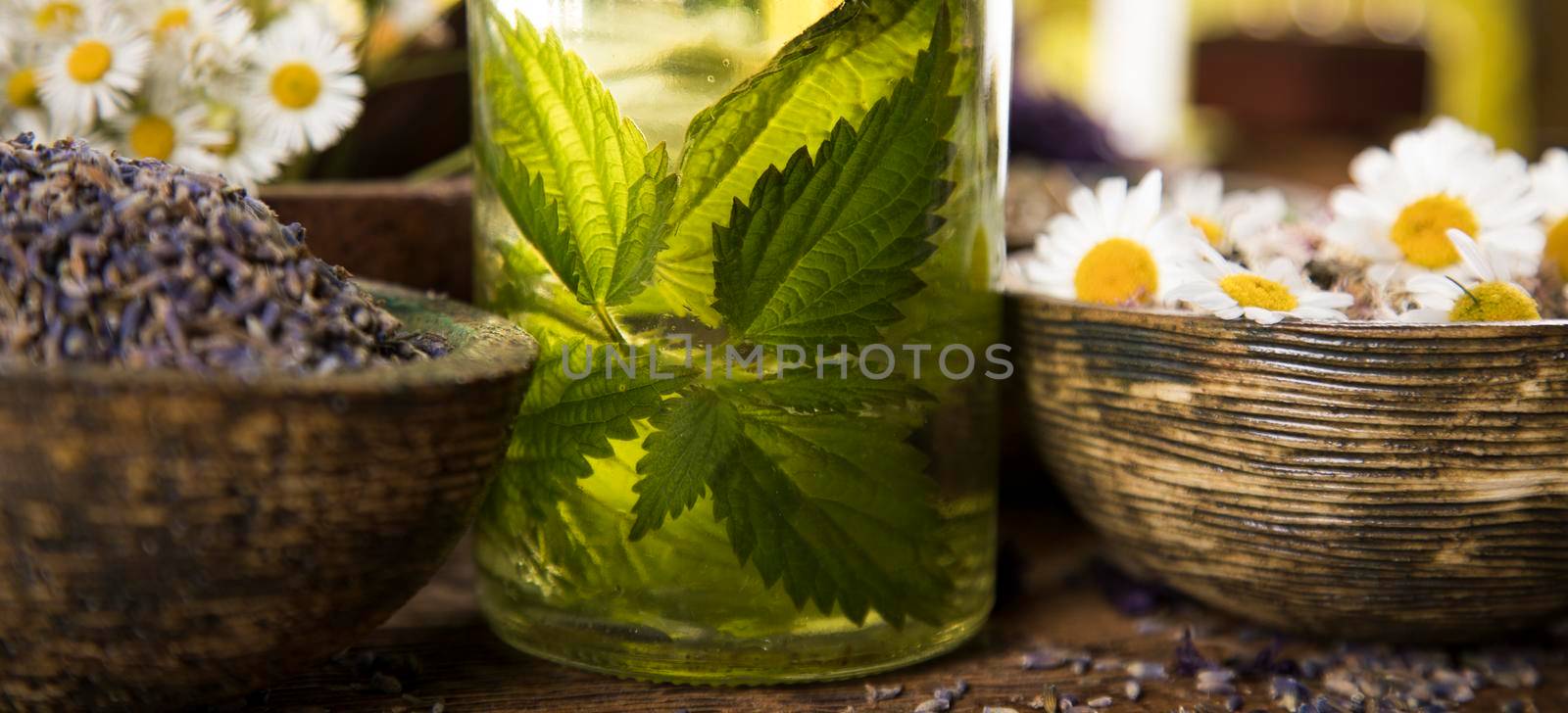 Natural medicine and mortar, healing herbs background by JanPietruszka