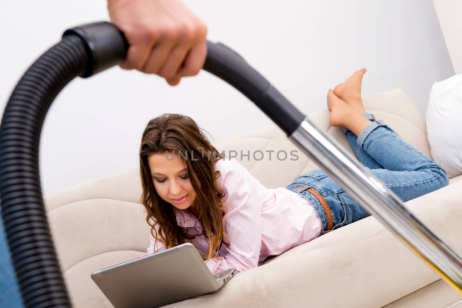 Cleaning the house with vacuum cleaner